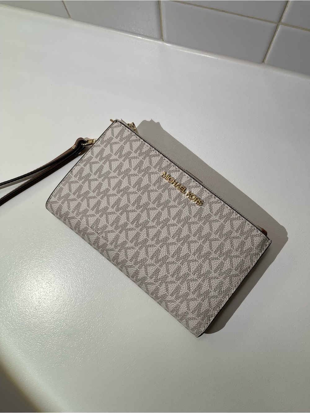 Michael Kors Monogram Wristlet in Light Gray and Brown Trim